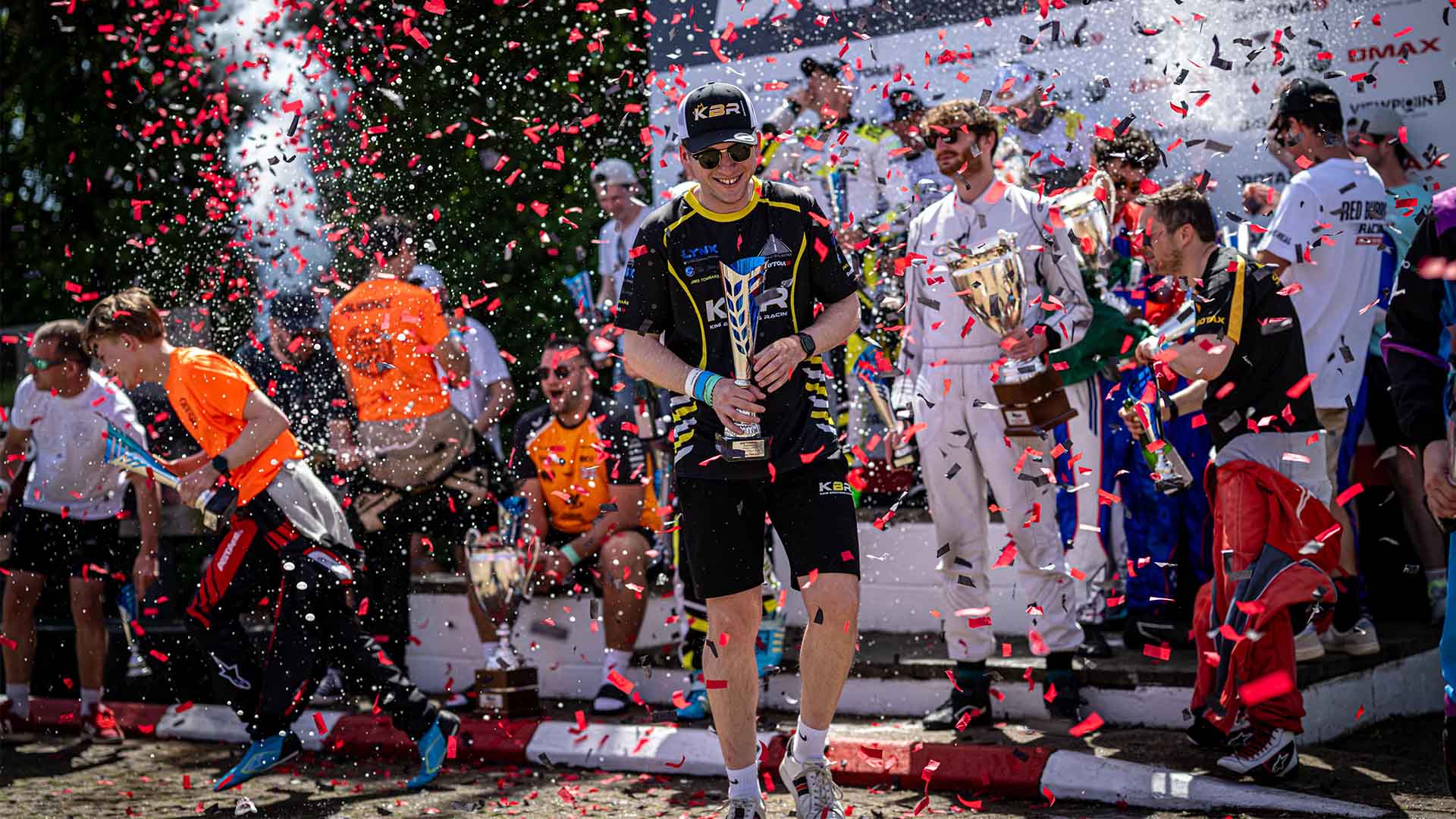 Daytona 24 Hours racing teams celebrating with trophies on the podium