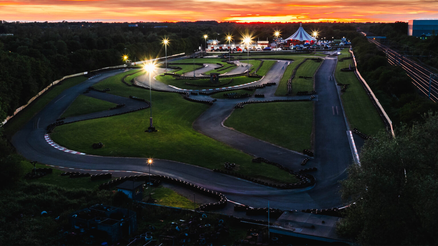 Aerial view of Daytona Milton Keynes outdoor go-karting circuit at sunset